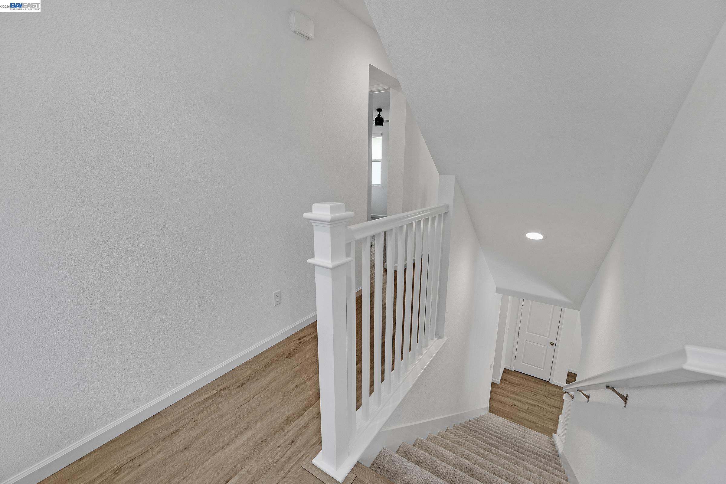 5990 Peridot Place Dublin, CA 94568 - Photo 17 of 43 a view of a hallway with wooden floor and entryway
