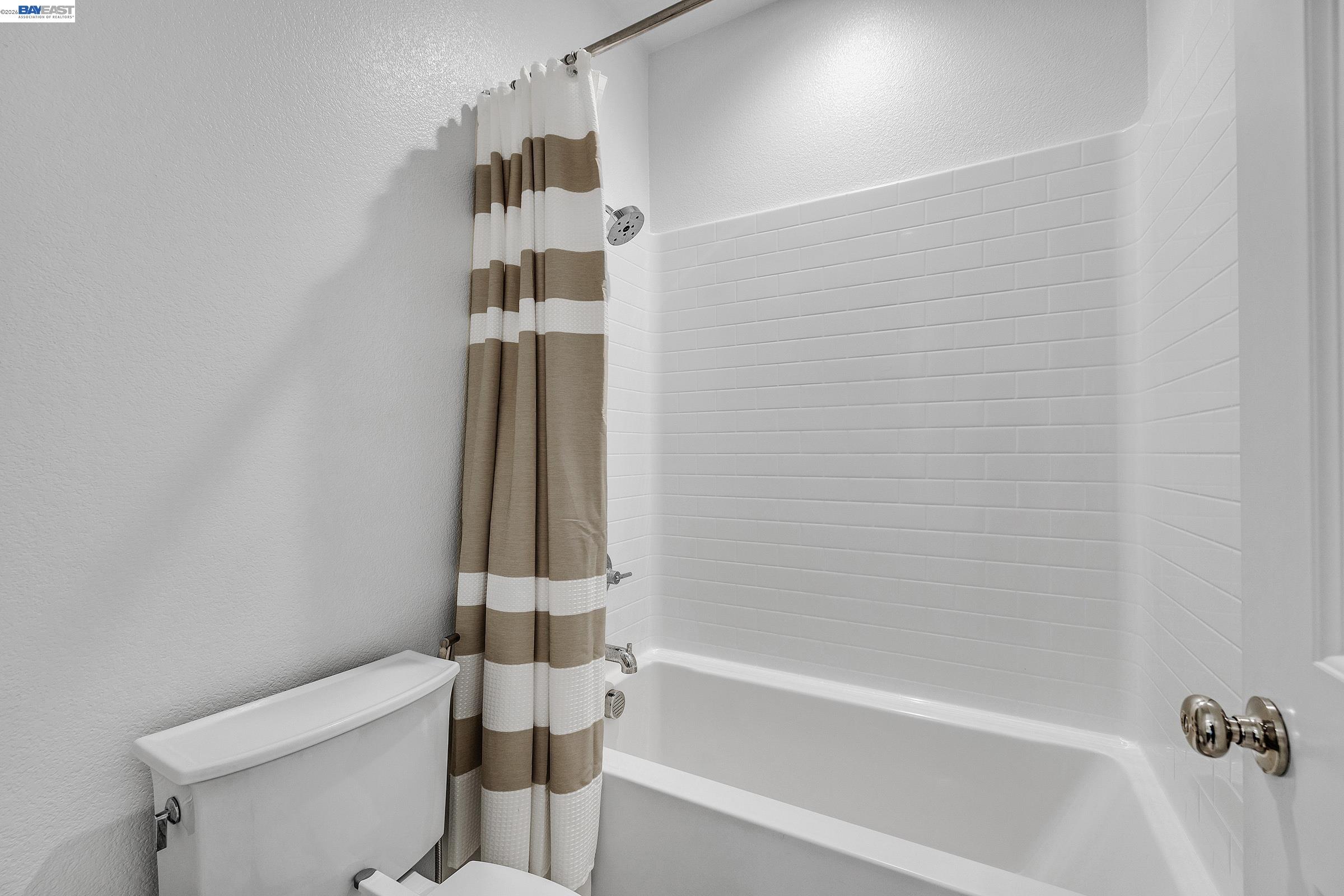 5990 Peridot Place Dublin, CA 94568 - Photo 21 of 43 a bathroom with a bathtub and a shower