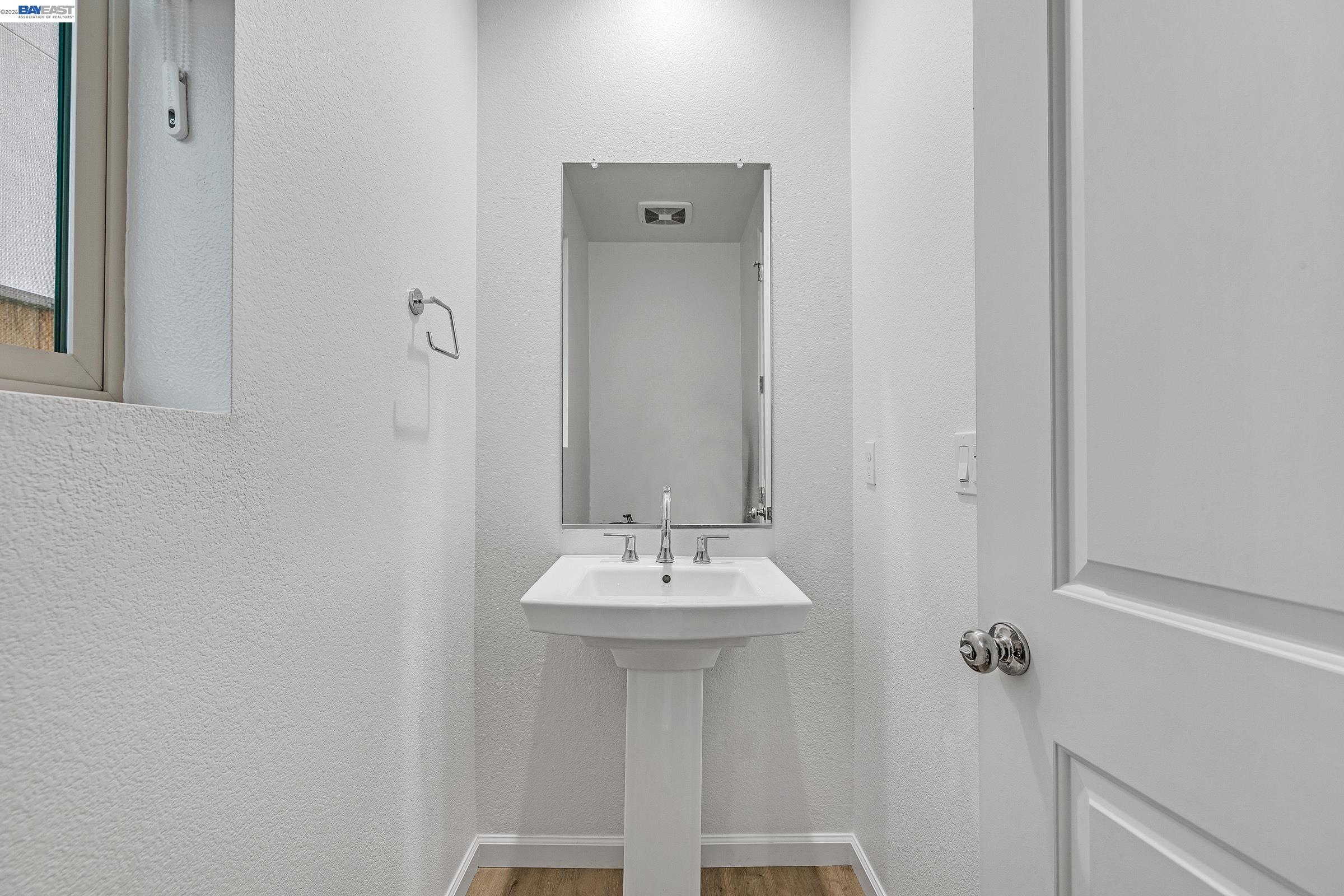 5990 Peridot Place Dublin, CA 94568 - Photo 8 of 43 a bathroom with a sink and a mirror