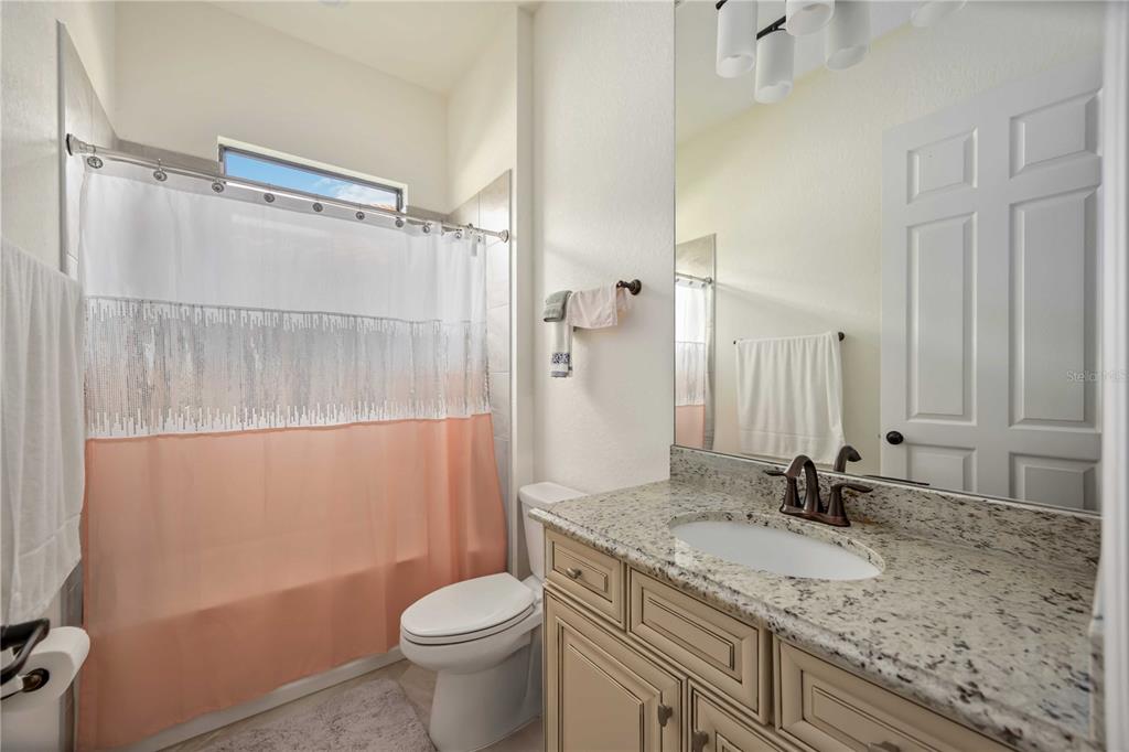5931 Brandon Run Bradenton, FL 34211 - Photo 16 of 42 a bathroom with a granite countertop sink toilet and shower