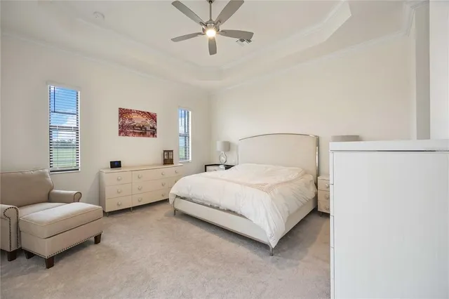 a bedroom with a bed couch and window