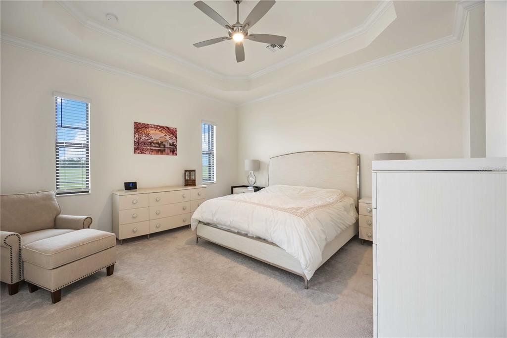 5931 Brandon Run Bradenton, FL 34211 - Photo 17 of 42 a bedroom with a bed couch and window