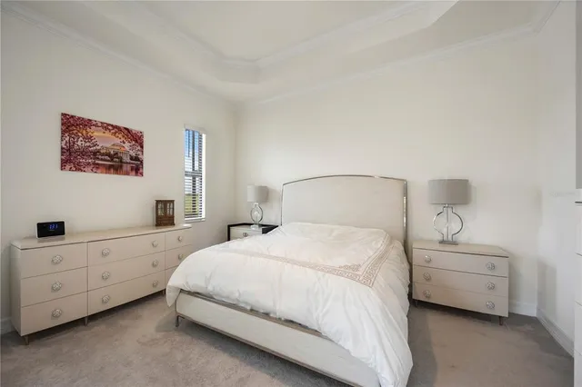 a bedroom with a bed and a night stand