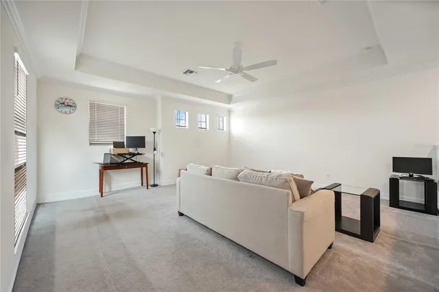 a living room with furniture and a piano