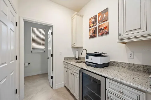 a kitchen with stainless steel appliances granite countertop a sink and a stove