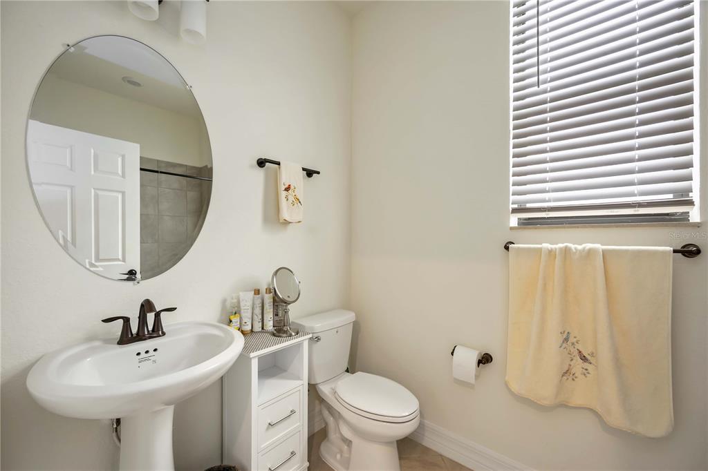 5931 Brandon Run Bradenton, FL 34211 - Photo 26 of 42 a bathroom with a toilet sink and mirror