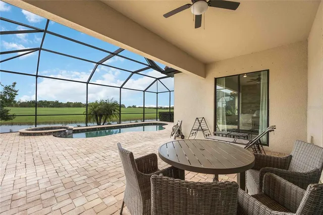 a dining room with furniture and a window