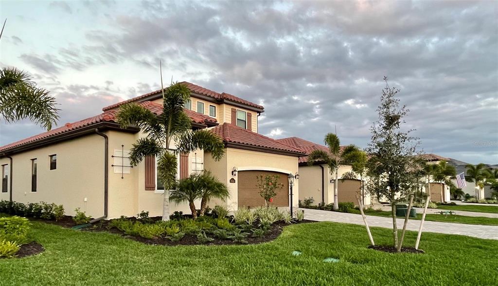 5931 Brandon Run Bradenton, FL 34211 - Photo 3 of 42 a front view of house with a garden