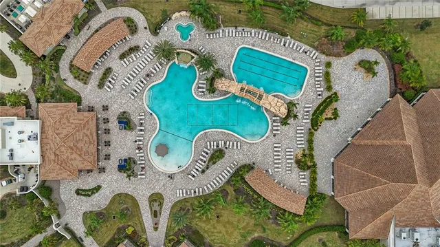 an aerial view of a swimming pool and outdoor space