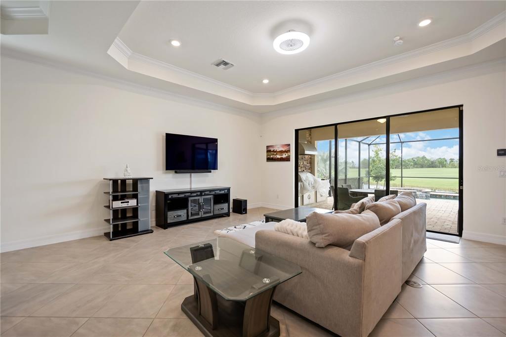 5931 Brandon Run Bradenton, FL 34211 - Photo 6 of 42 a living room with furniture and a flat screen tv