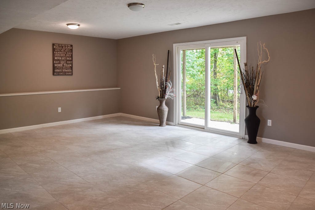 2376 Graham Road Stow, OH 44224 - Photo 3 of 21 Family room with ceramic tile flooring and a sliding door to the patio.
