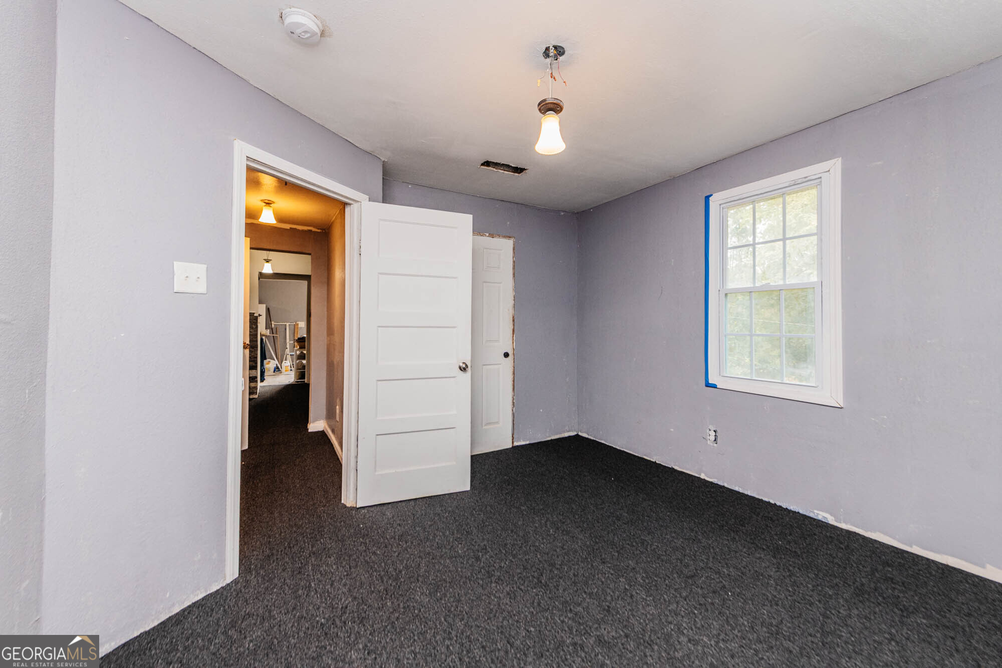 3706 Riggins Mill Road Macon, GA 31217 - Photo 16 of 30 an empty room with windows and closet