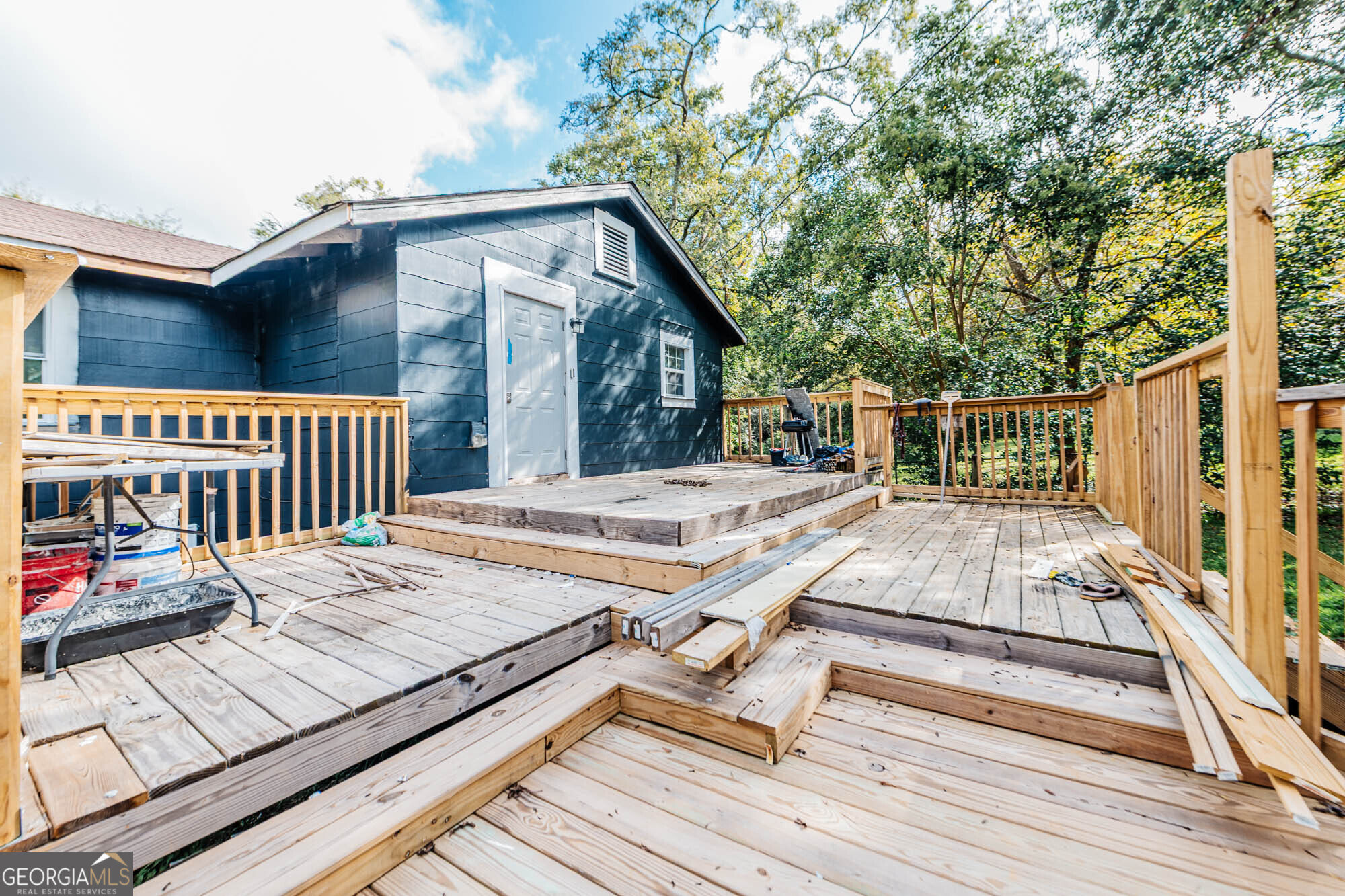 3706 Riggins Mill Road Macon, GA 31217 - Photo 29 of 30 a roof deck with wooden floor and fence