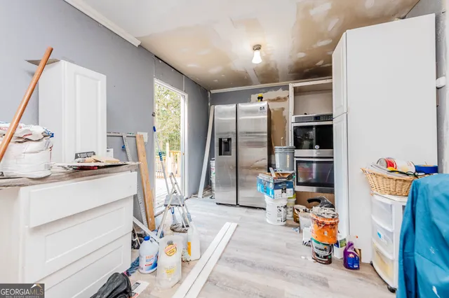 a storage room with washer and dryer