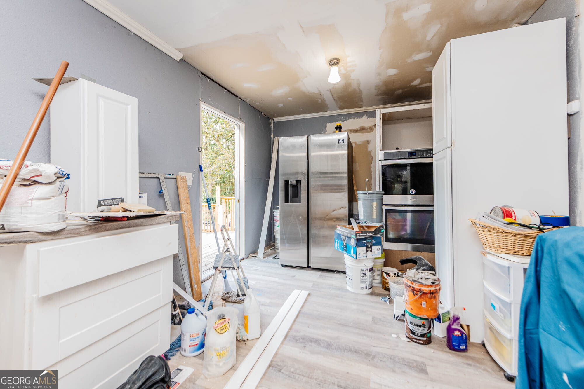 3706 Riggins Mill Road Macon, GA 31217 - Photo 4 of 30 a storage room with washer and dryer