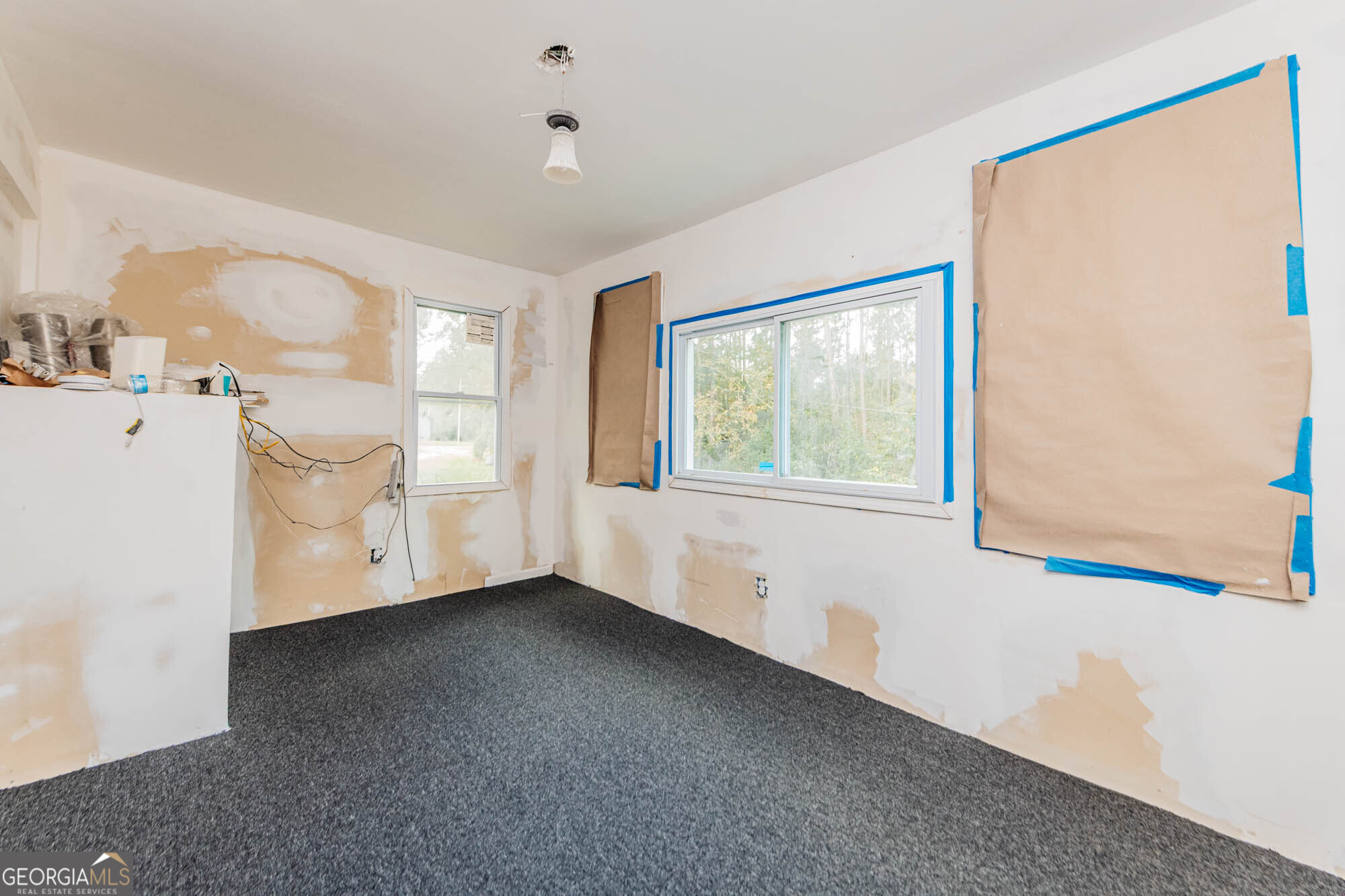 3706 Riggins Mill Road Macon, GA 31217 - Photo 7 of 30 a view of an empty room with a window