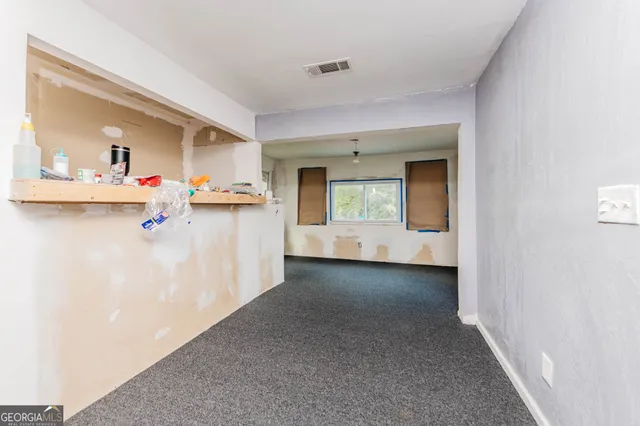 a view of a kitchen and a window