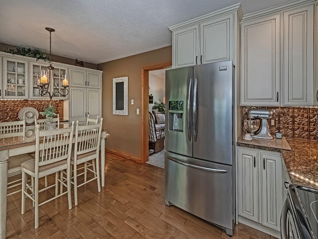 638 Knoll Lane Apollo, PA 15613 - Photo 8 of 30 a kitchen with stainless steel appliances a refrigerator and wooden floor