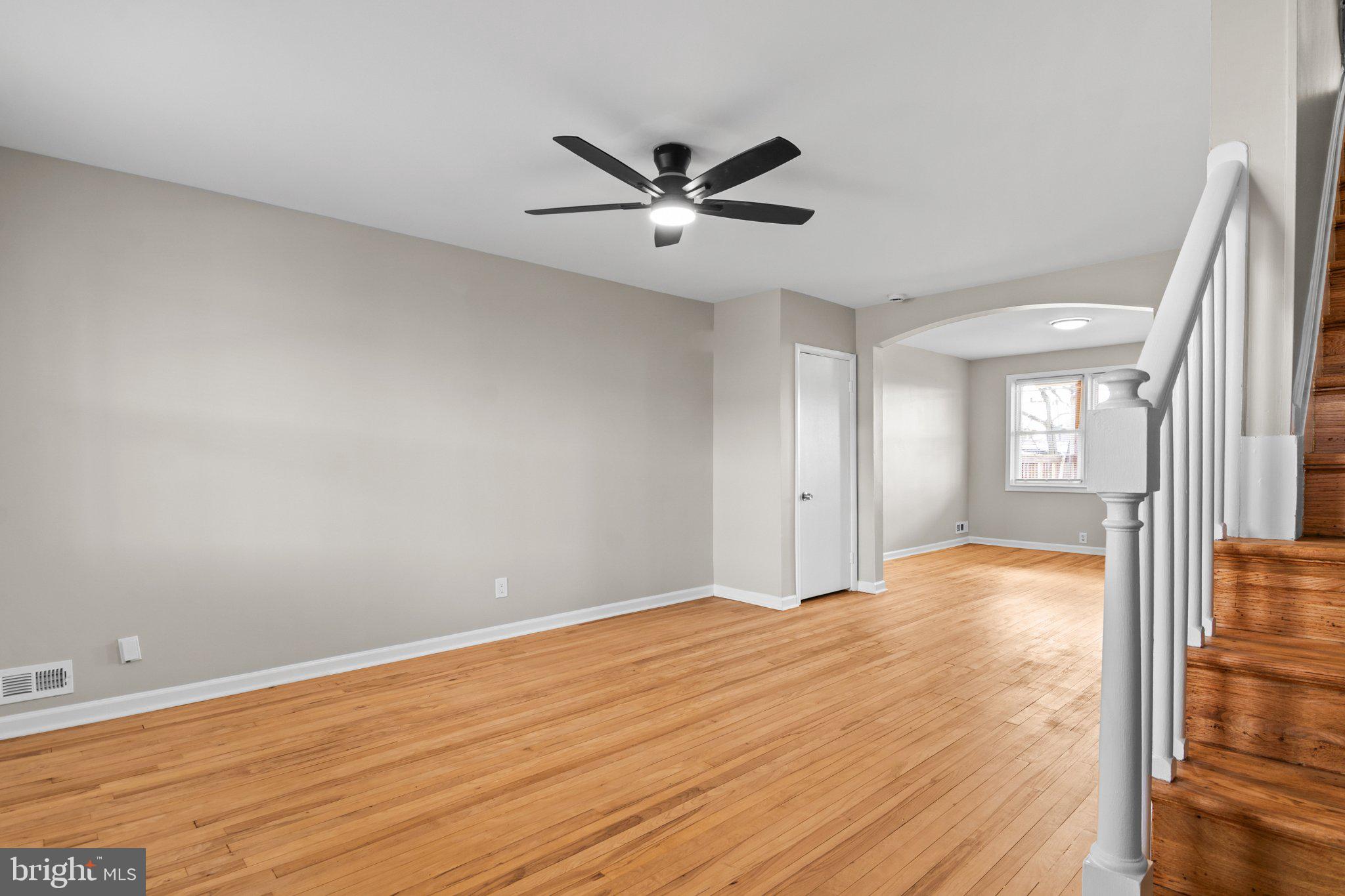 6929 Bank Street Baltimore, MD 21224 - Photo 14 of 30 a view of an empty room with wooden floor and a window
