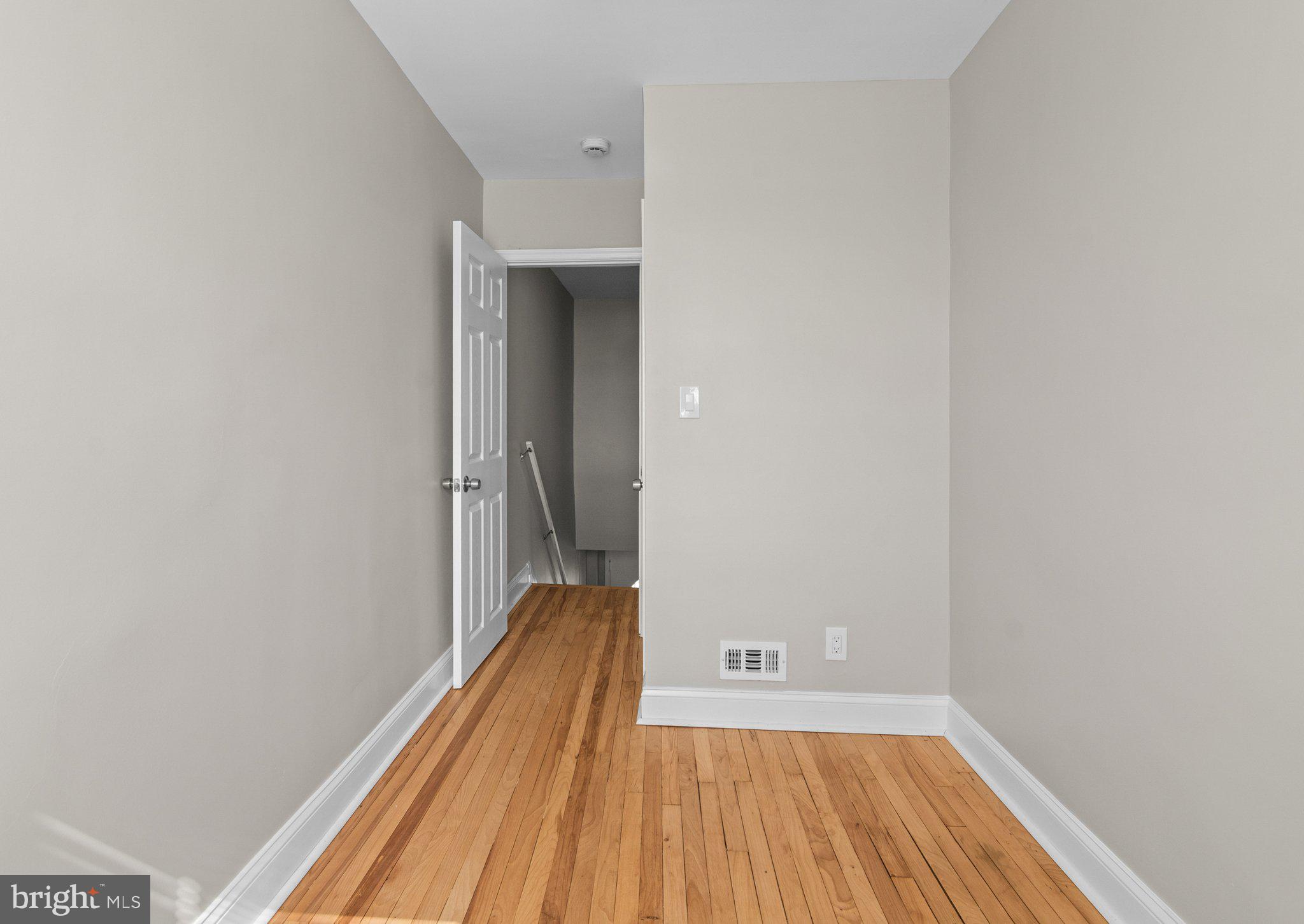 6929 Bank Street Baltimore, MD 21224 - Photo 19 of 30 a view of a room with wooden floor and a balcony