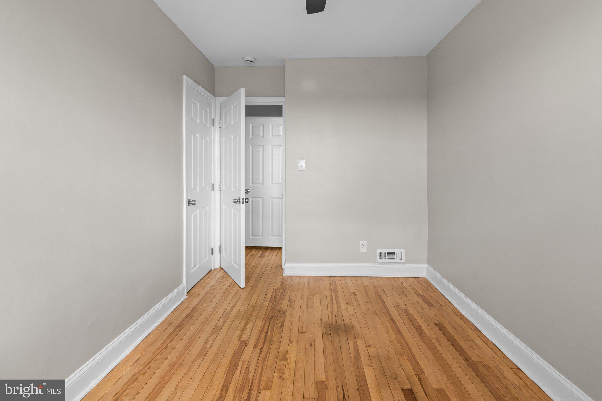 6929 Bank Street Baltimore, MD 21224 - Photo 21 of 30 a view of a room with wooden floor and white walls