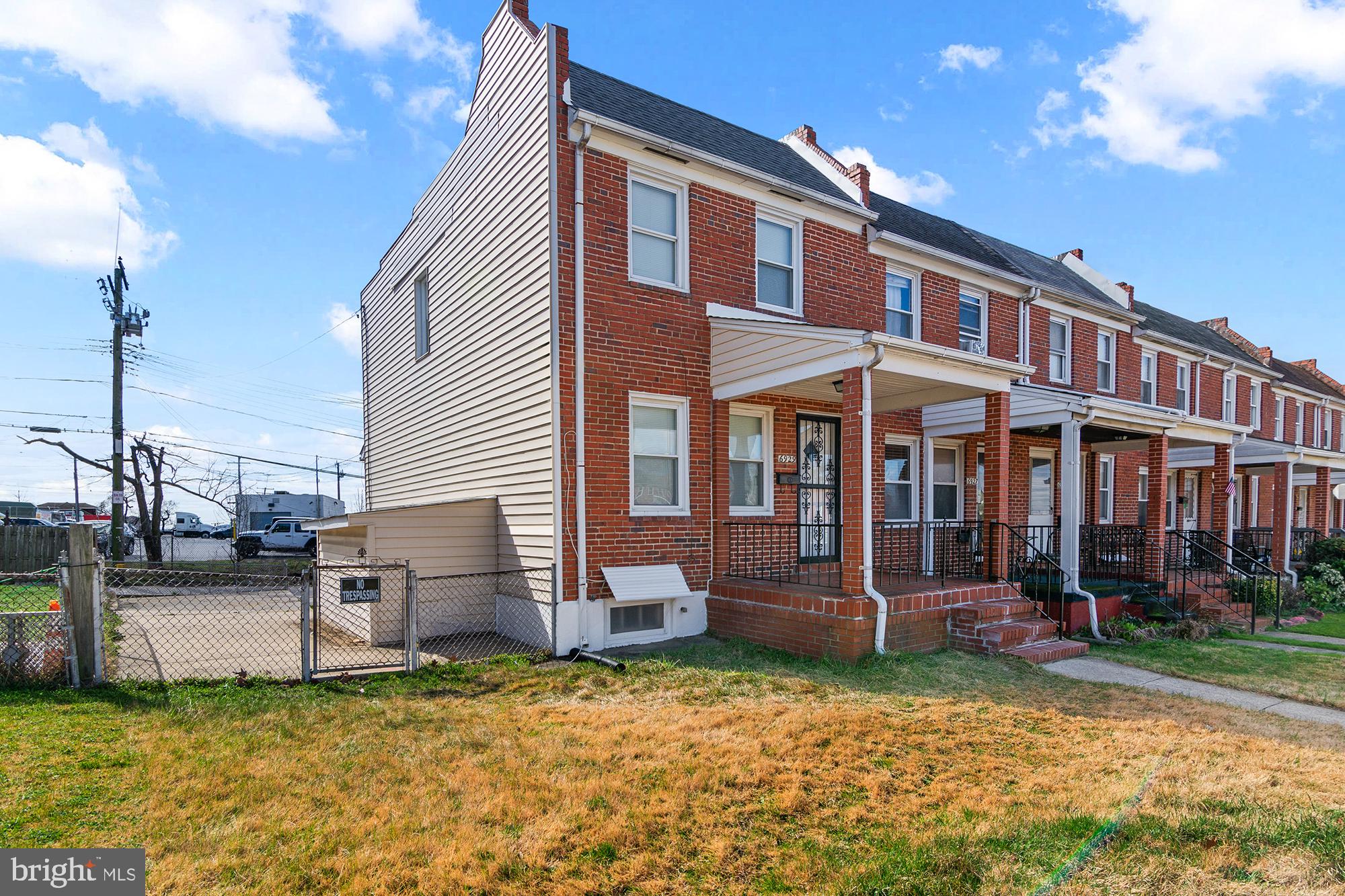 6929 Bank Street Baltimore, MD 21224 - Photo 30 of 30 a front view of a house with a yard