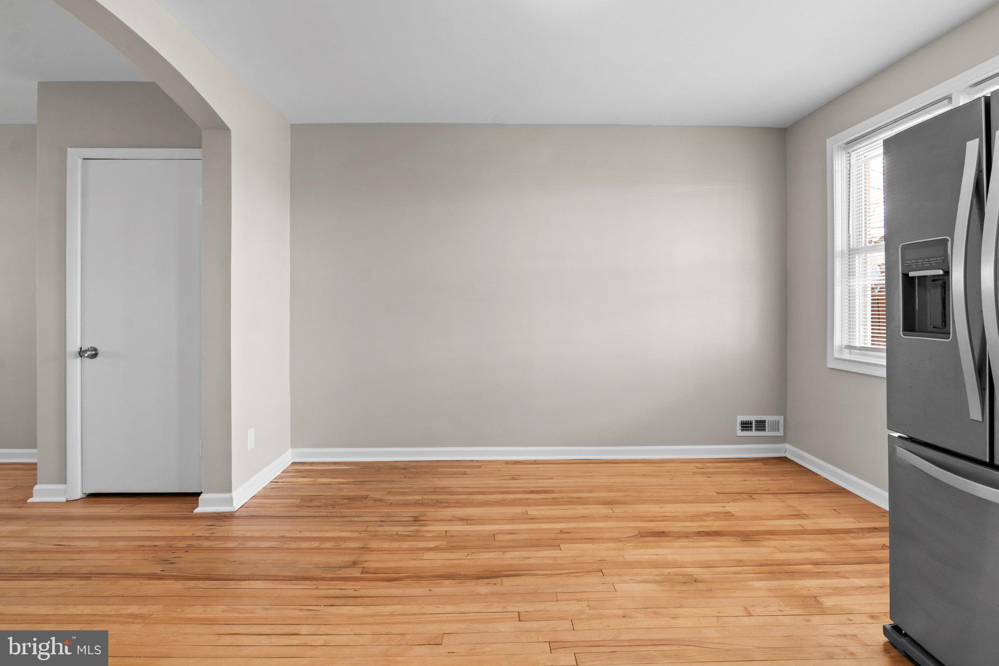 6929 Bank Street Baltimore, MD 21224 - Photo 8 of 30 a view of empty room with wooden floor