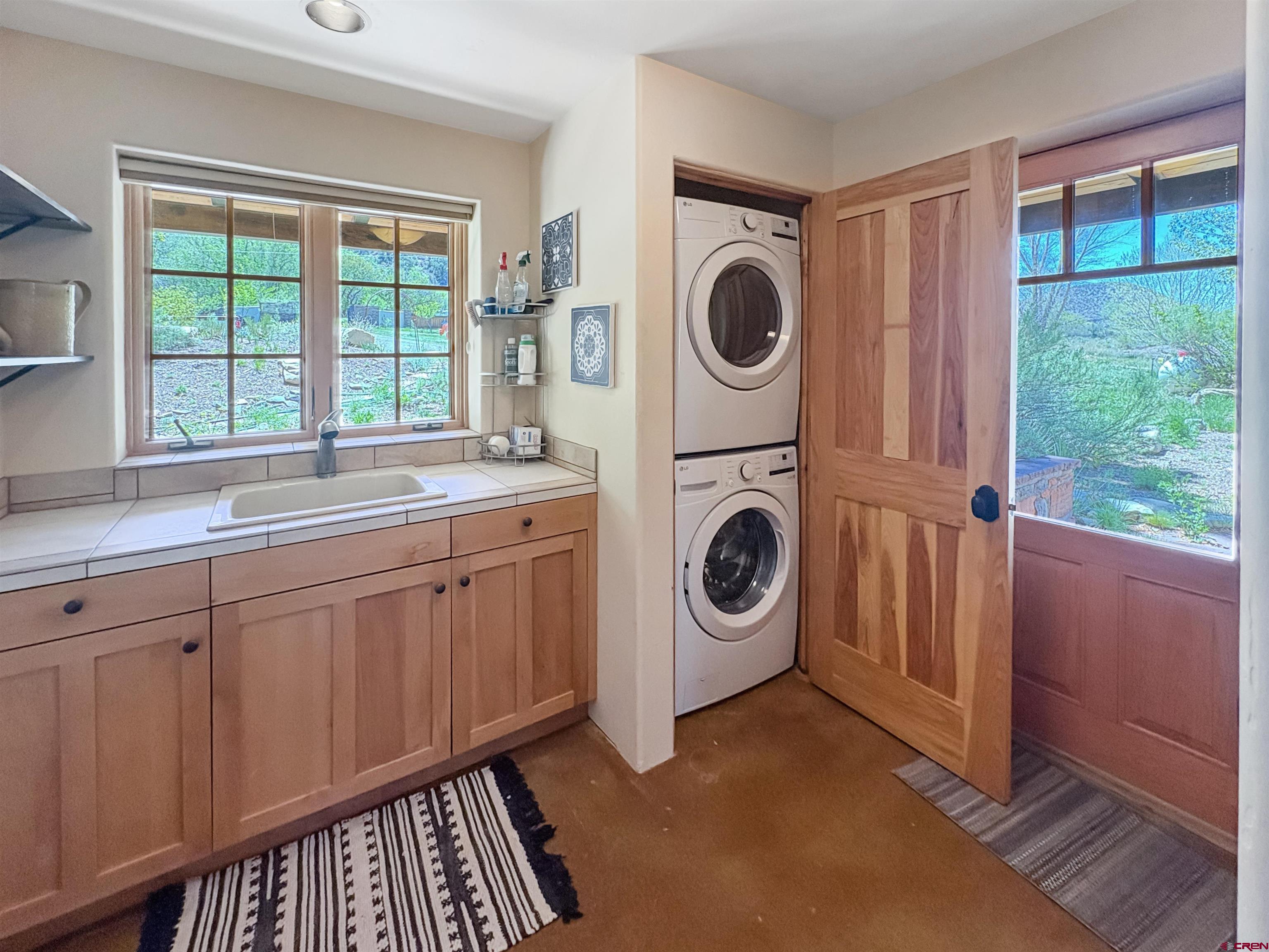 18261 Rd G Cortez, CO 81321 - Photo 16 of 44 a utility room with sink dryer and washer