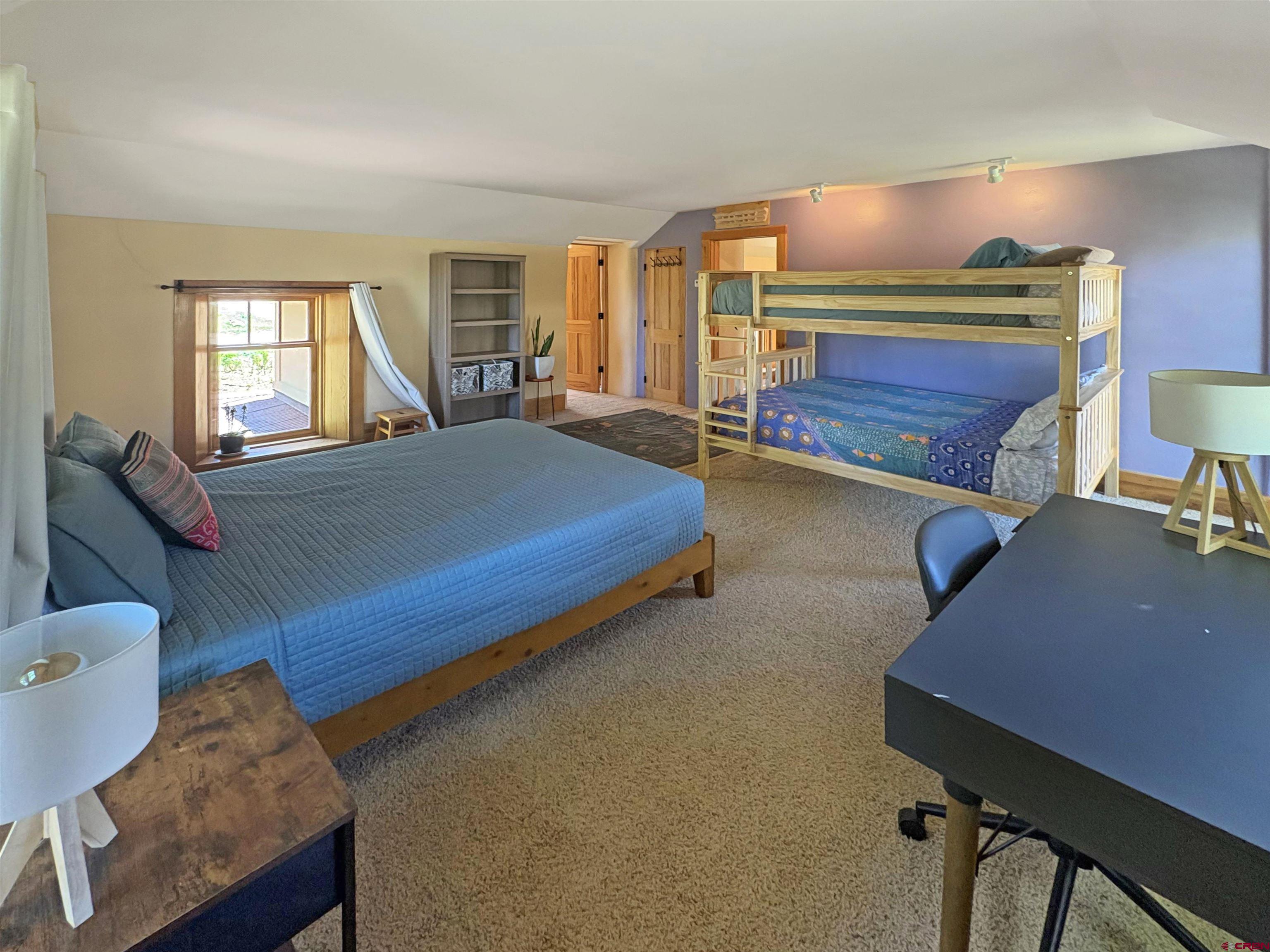 18261 Rd G Cortez, CO 81321 - Photo 19 of 44 a bedroom with bed and window