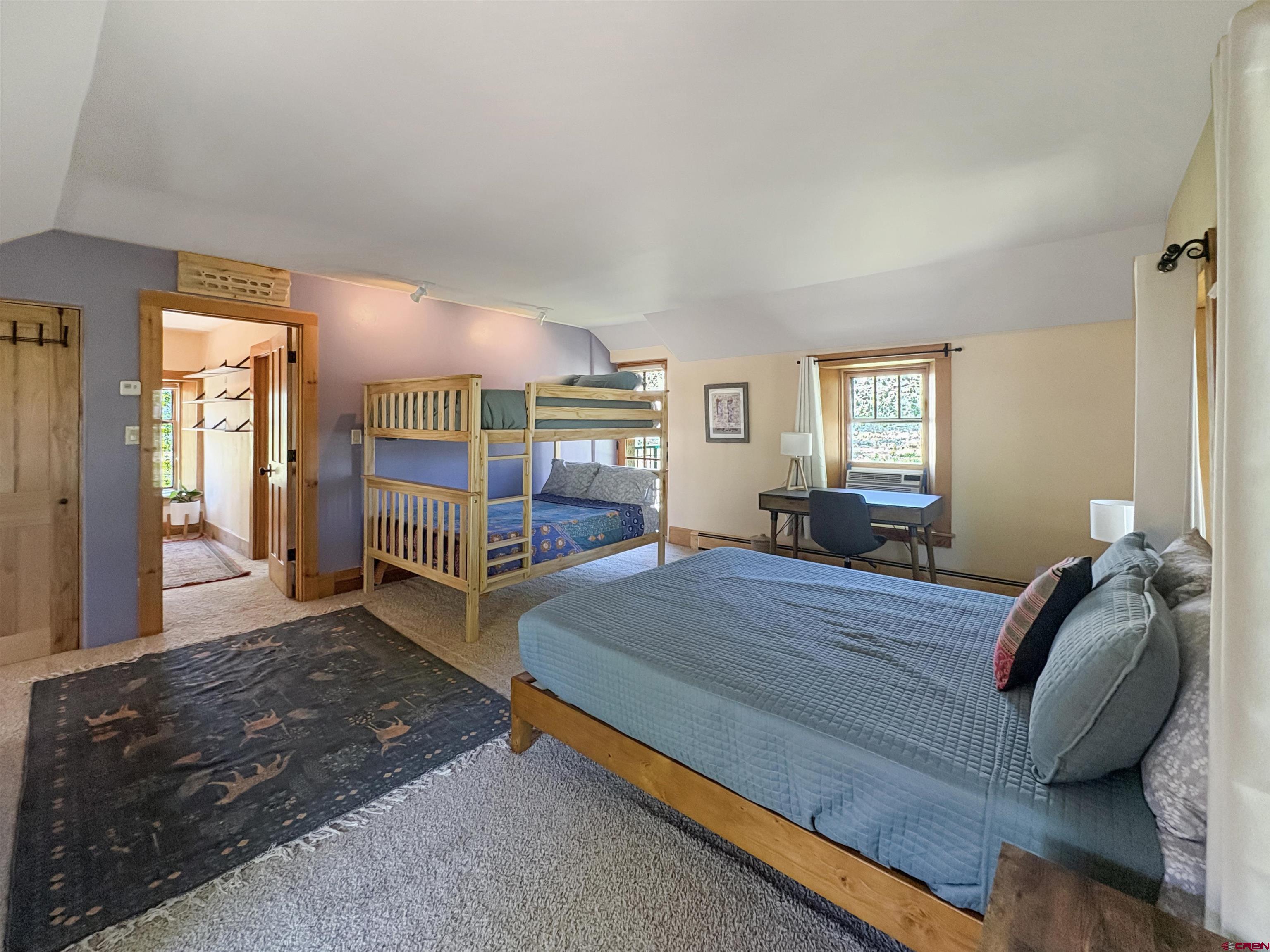 18261 Rd G Cortez, CO 81321 - Photo 20 of 44 a bedroom with a bed and large windows