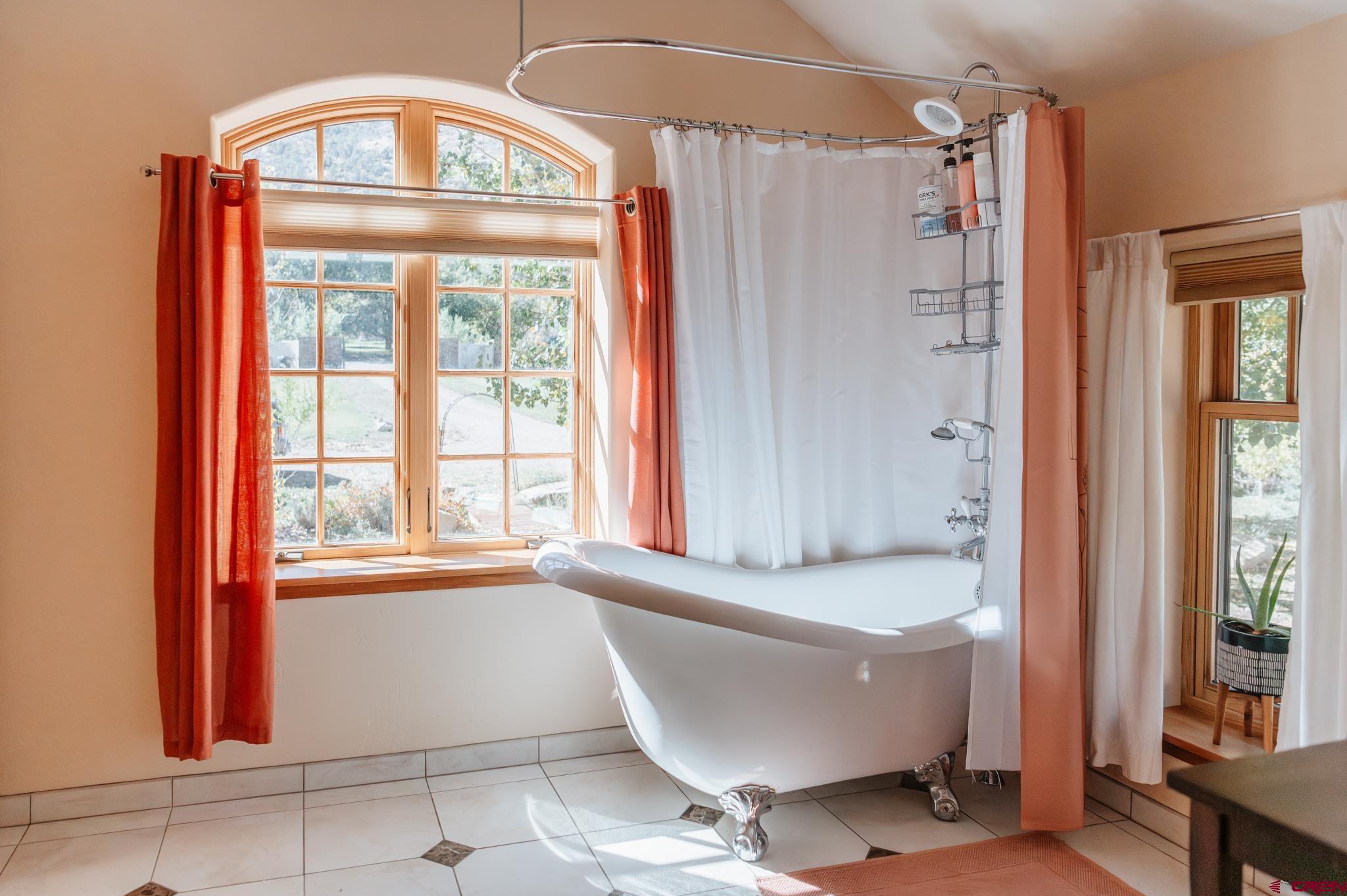 18261 Rd G Cortez, CO 81321 - Photo 21 of 45 a bathroom with a bathtub and a shower