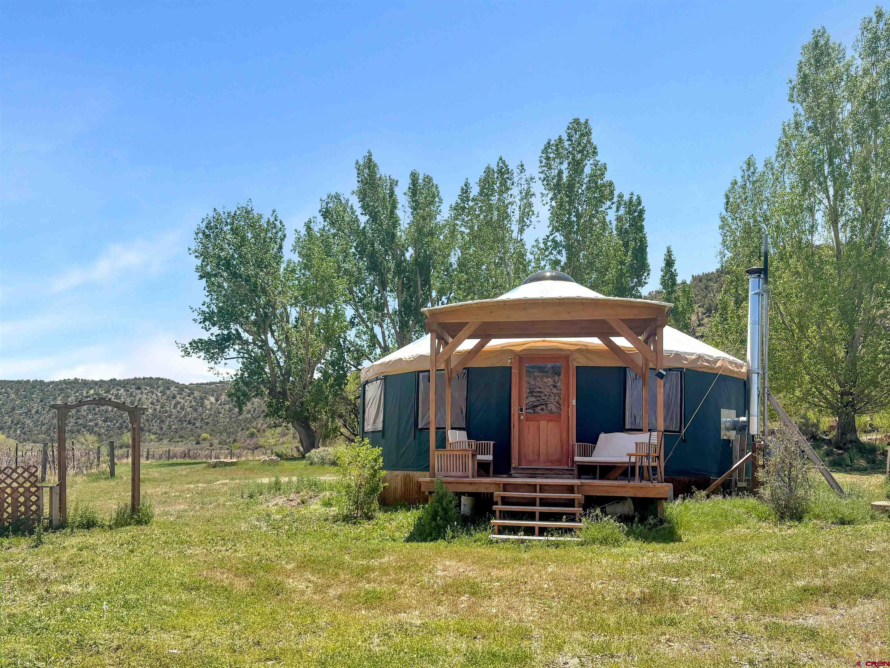 18261 Rd G Cortez, CO 81321 - Photo 27 of 44 a view of a house with backyard porch and garden