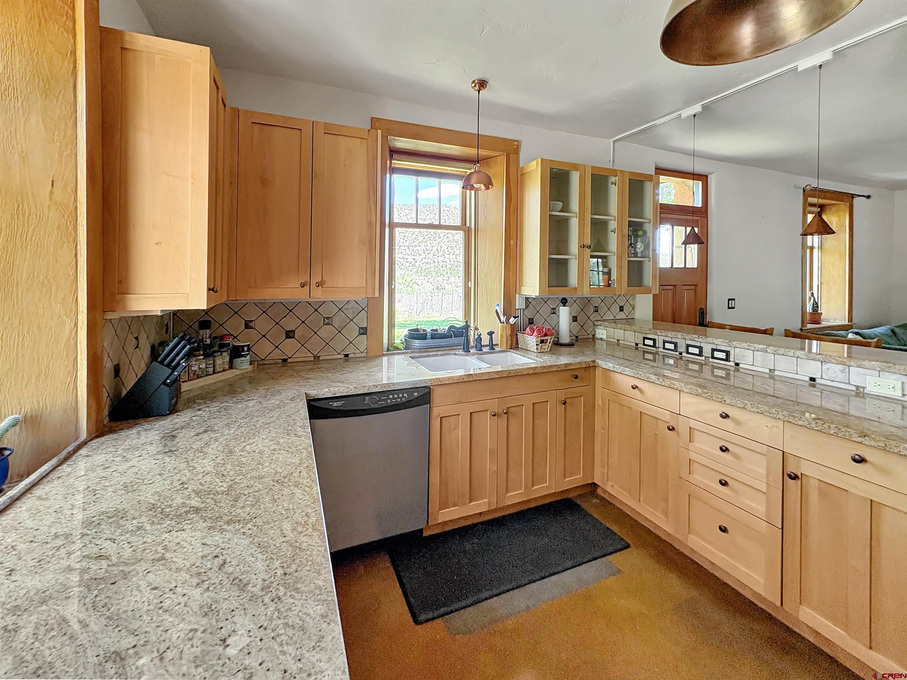 18261 Rd G Cortez, CO 81321 - Photo 9 of 44 a kitchen with sink refrigerator and window
