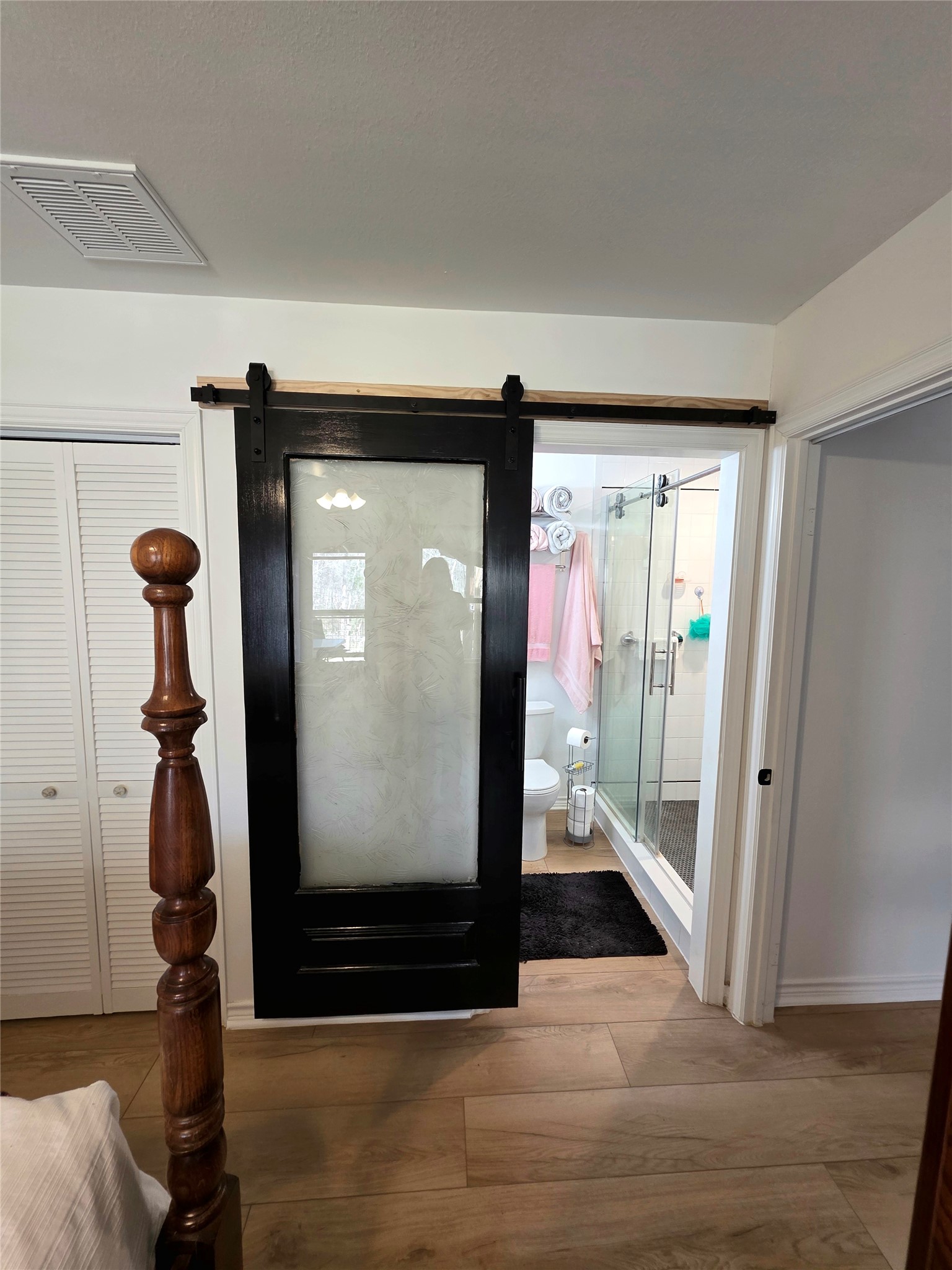 978 County Road 2859 Cleveland, TX 77327 - Photo 18 of 50 Love this barn door leading to master bath.