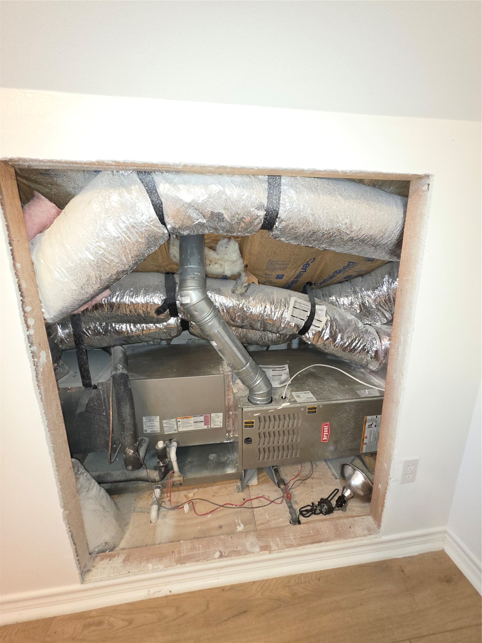 978 County Road 2859 Cleveland, TX 77327 - Photo 26 of 50 a water heater sitting on top of a shelf