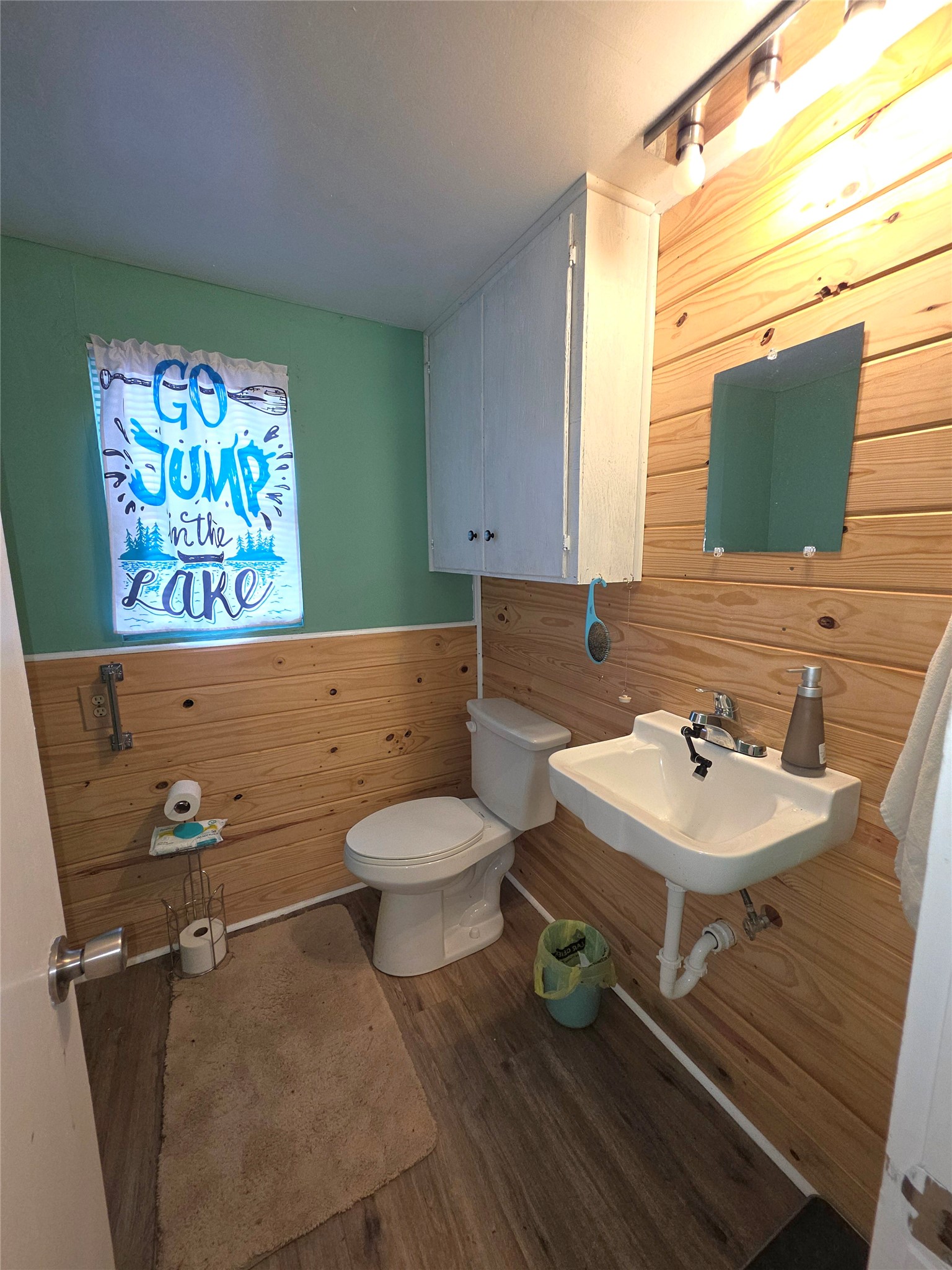 978 County Road 2859 Cleveland, TX 77327 - Photo 35 of 50 a bathroom with a sink mirror and toilet