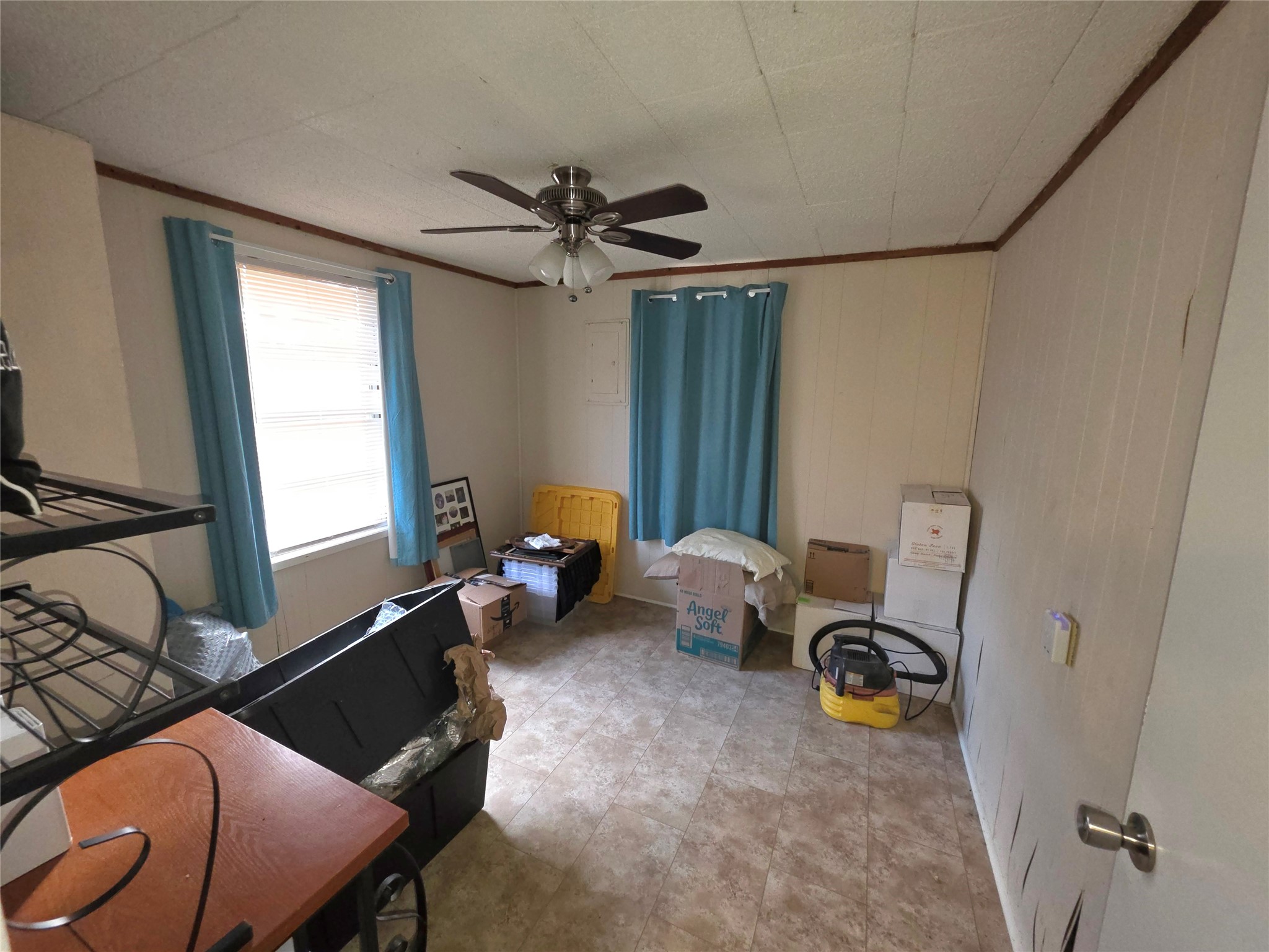 978 County Road 2859 Cleveland, TX 77327 - Photo 37 of 50 a living room with furniture a window and gym cycle