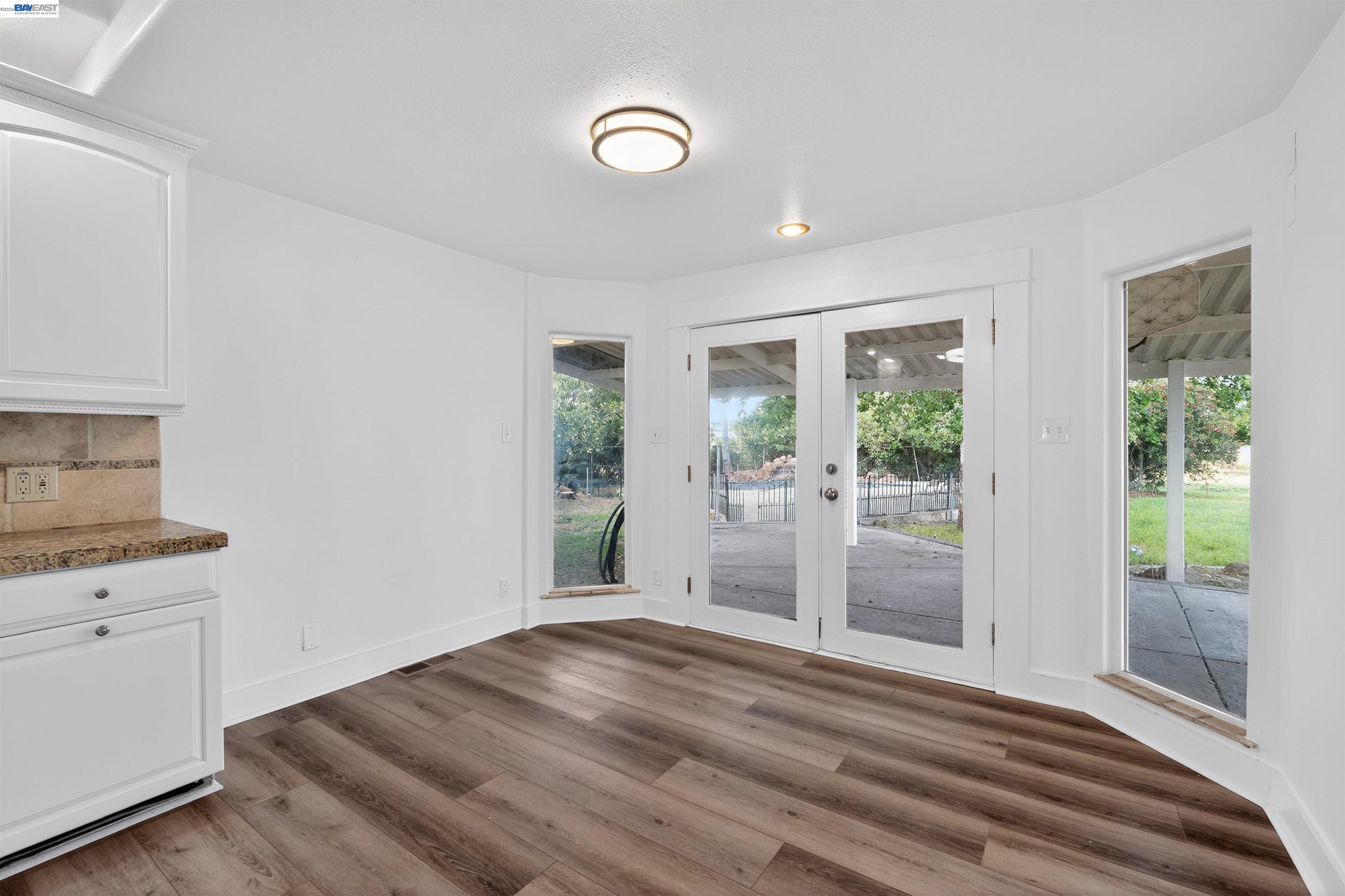 3015 Point Pleasant Road Elk Grove, CA 95757 - Photo 11 of 32 a view of empty room with wooden floor and fan