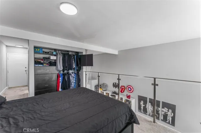 a bed room with a bed and a walk in closet