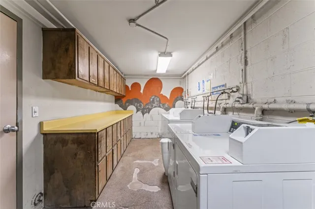 a vase of flowers sitting on a floor