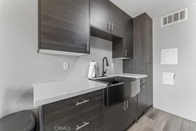a kitchen with stainless steel appliances a sink stove and cabinets