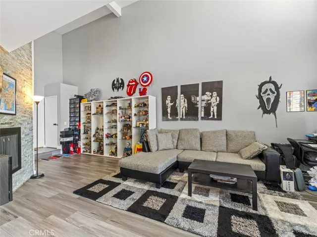 a living room with furniture and a fireplace