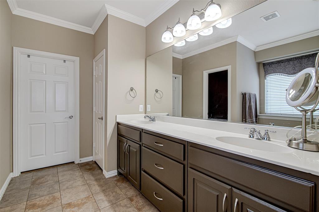 328 Tioga Street Burleson, TX 76028 - Photo 16 of 29 a bathroom with a double vanity sink and a mirror