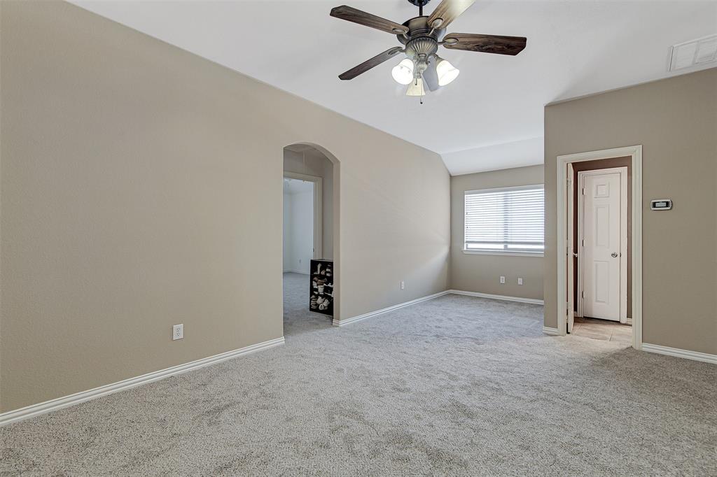 328 Tioga Street Burleson, TX 76028 - Photo 19 of 29 an empty room with chandelier fan