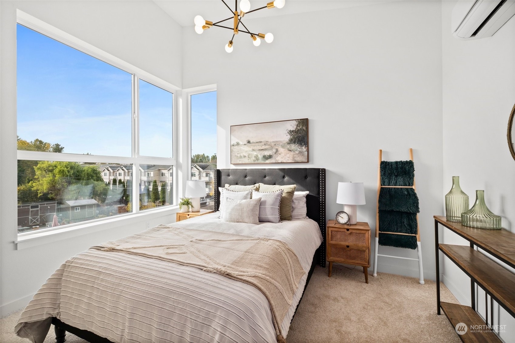 8451 24th Avenue Southwest, Unit B Seattle, WA 98106 - Photo 11 of 20 a bedroom with a large bed and a tv