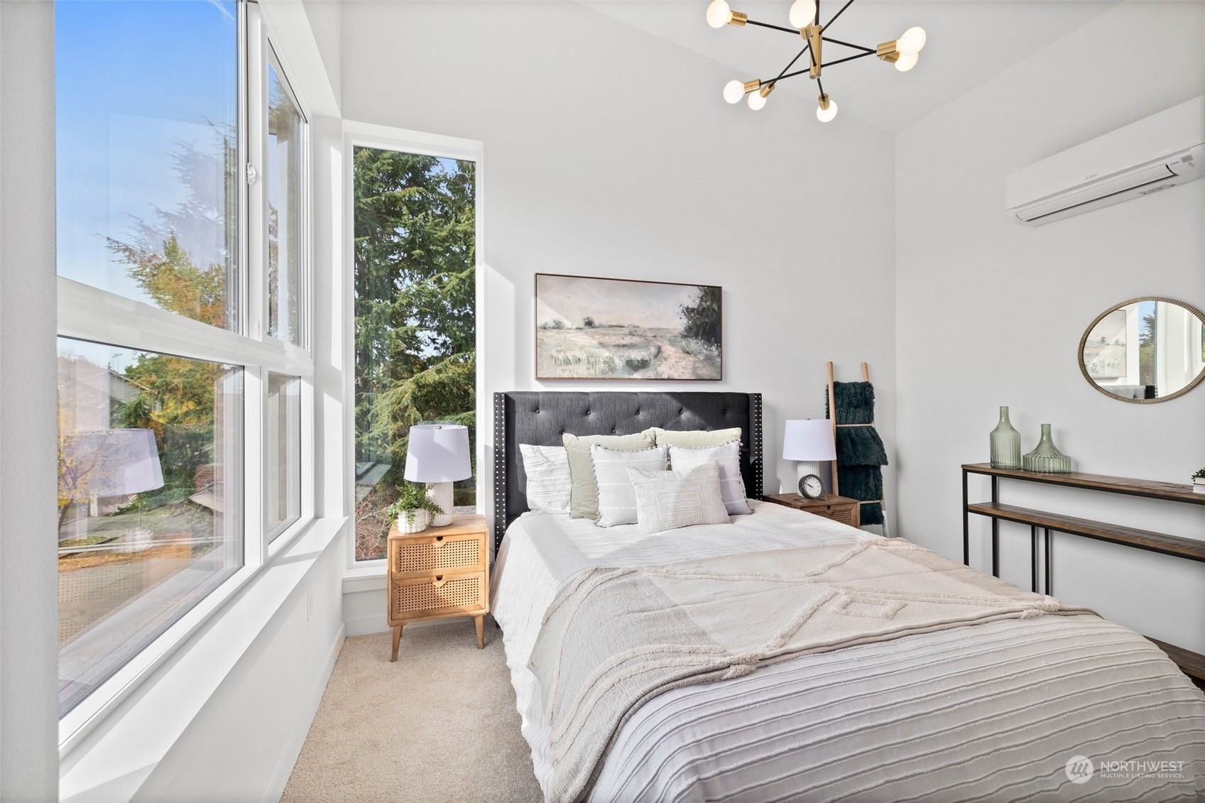 8451 24th Avenue Southwest, Unit B Seattle, WA 98106 - Photo 12 of 20 a bedroom with a large bed and a chandelier