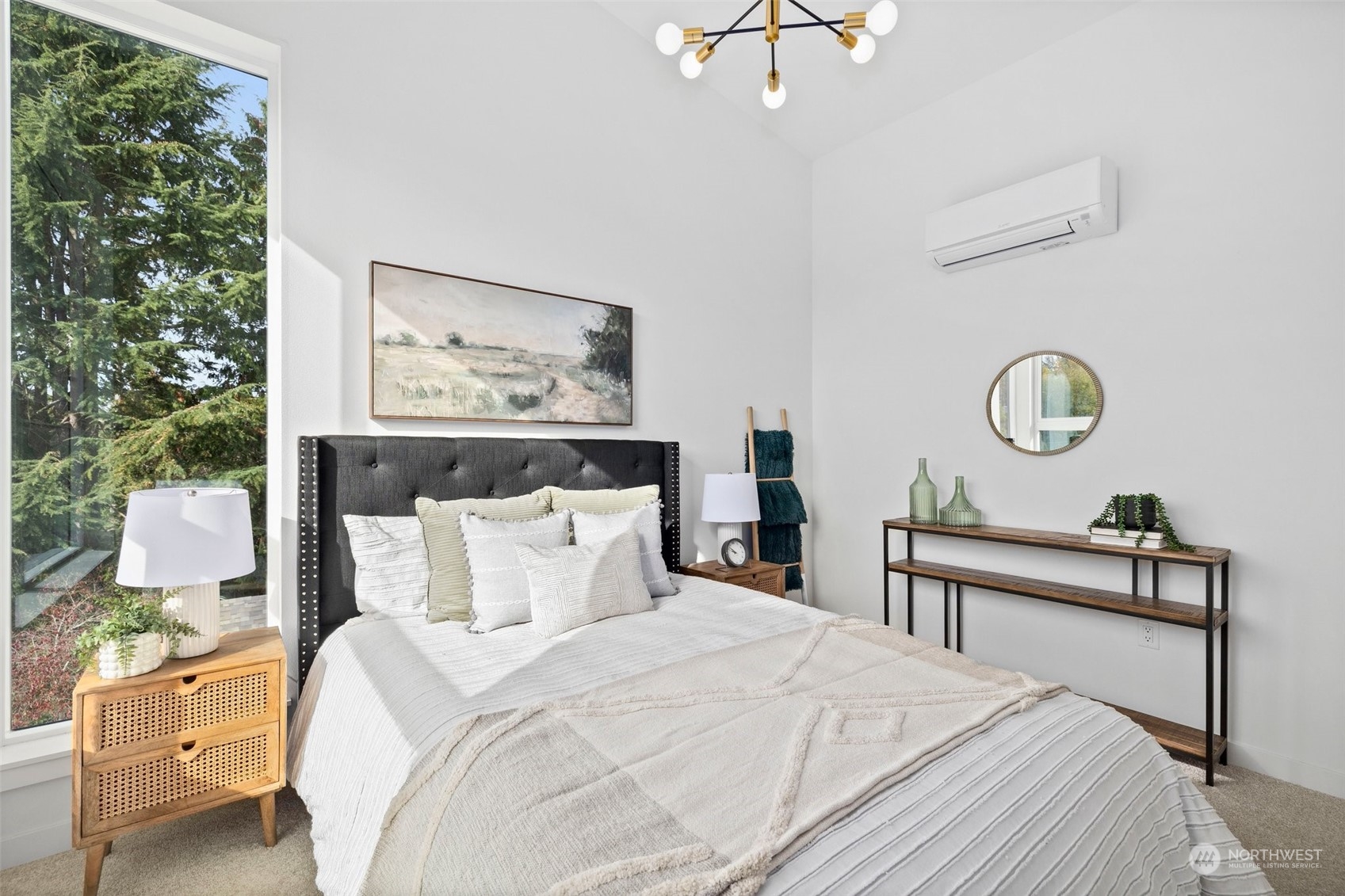 8451 24th Avenue Southwest, Unit B Seattle, WA 98106 - Photo 13 of 20 a bedroom with a bed and a chandelier