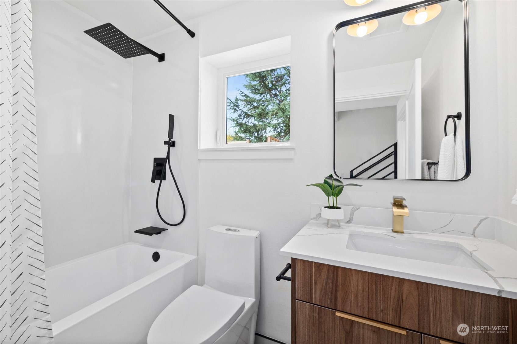 8451 24th Avenue Southwest, Unit B Seattle, WA 98106 - Photo 9 of 20 a bathroom with a sink a toilet and shower