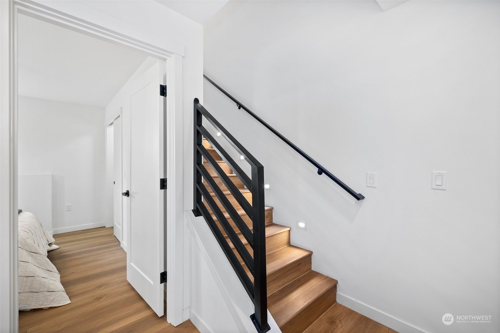 8451 24th Avenue Southwest, Unit B Seattle, WA 98106 - Photo 10 of 20 a view of entryway with wooden floor and stairs