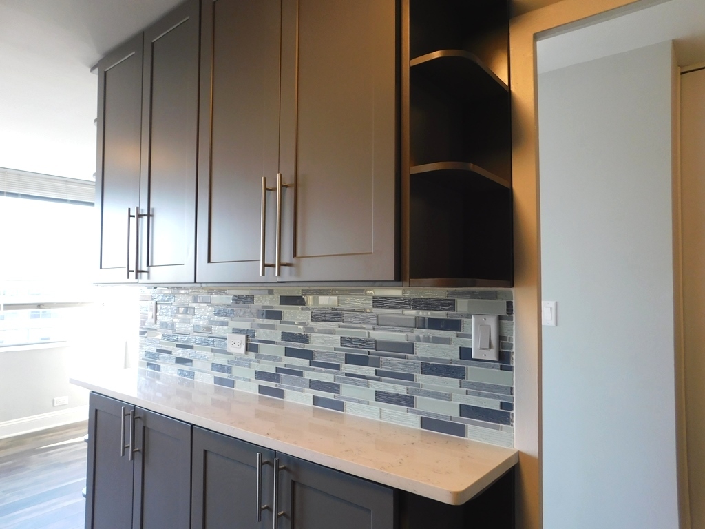 5701 North Sheridan Road, Unit 12L Chicago, IL 60660 - Photo 17 of 42 a kitchen with a sink and cabinets